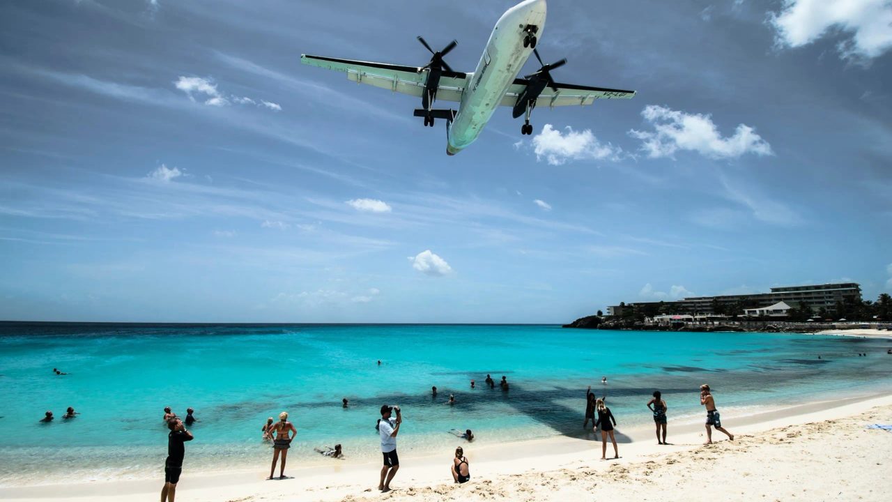 Flying Over Paradise: Maho Beach, the Caribbean Shoreline Brushed by Incoming and Departing Planes